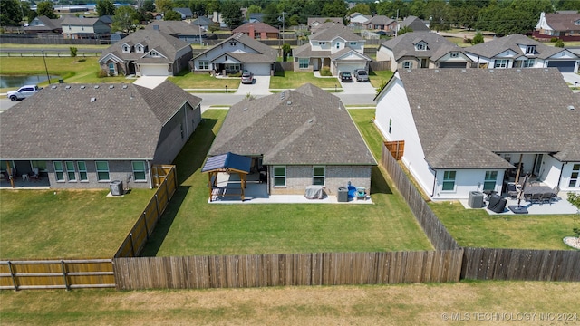 birds eye view of property with a residential view