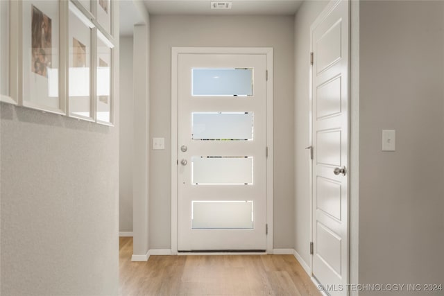 entryway with light hardwood / wood-style floors