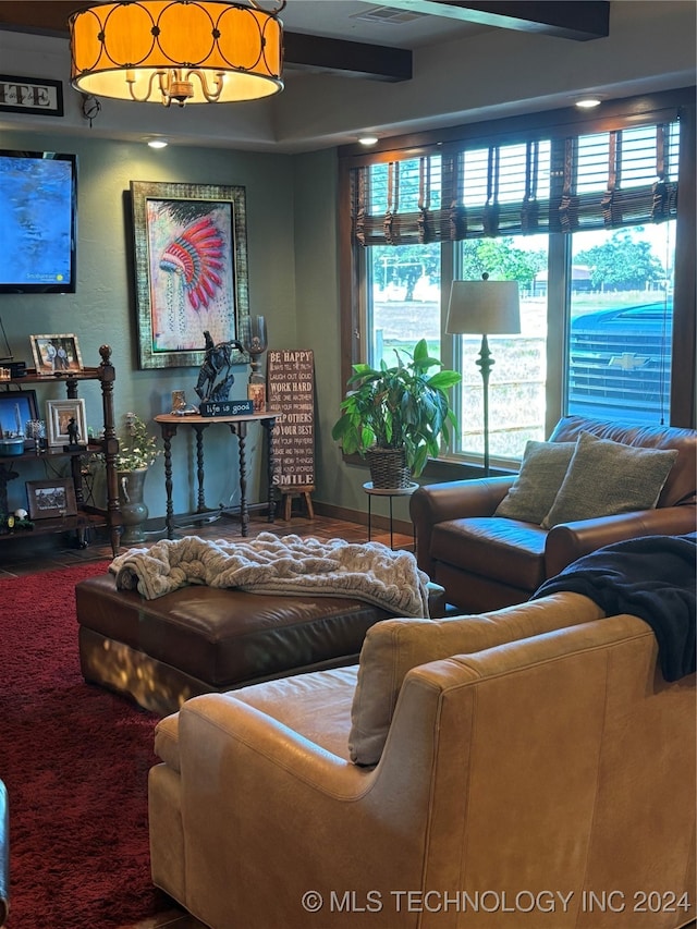 living room with beam ceiling