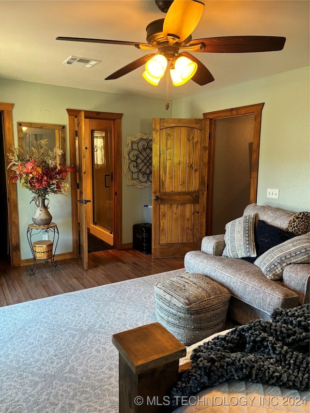 living room with dark hardwood / wood-style floors and ceiling fan