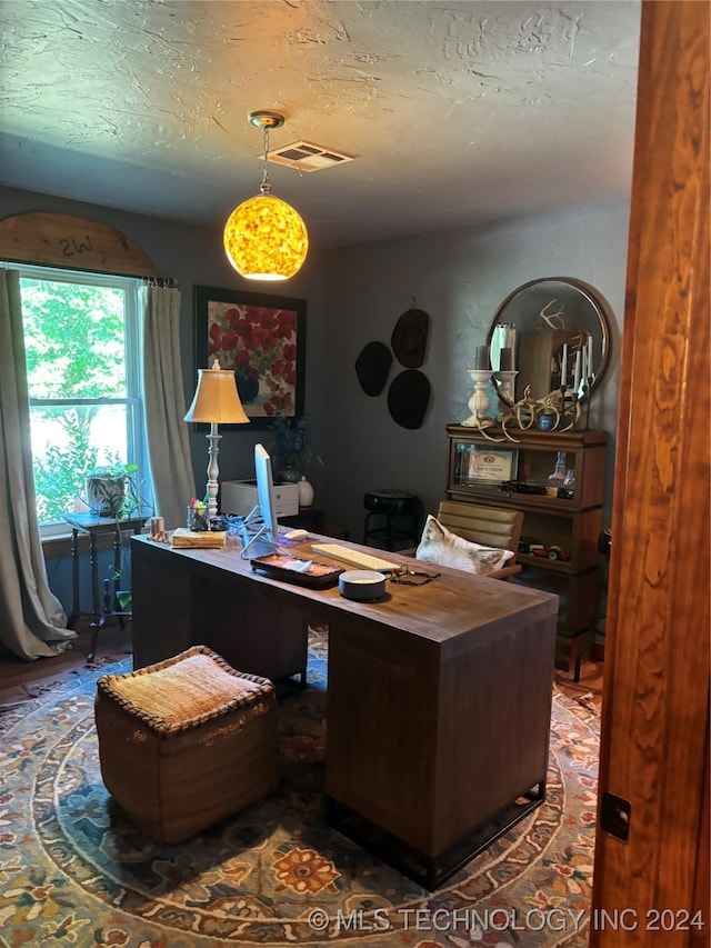 office space featuring a textured ceiling