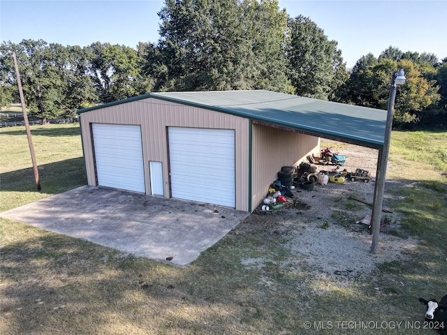 garage with a lawn