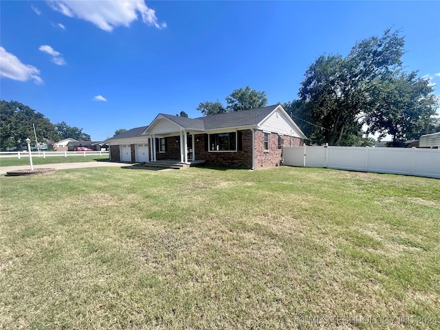 exterior space featuring a yard and a garage