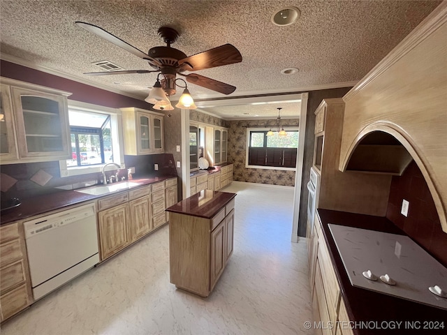 kitchen featuring light tile patterned floors, white dishwasher, a center island, sink, and a textured ceiling