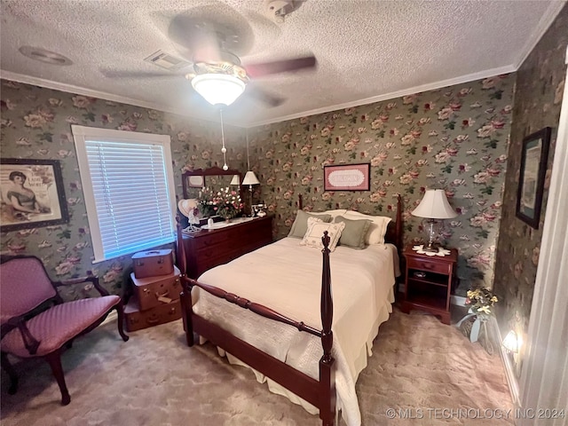 carpeted bedroom with ceiling fan, ornamental molding, and a textured ceiling