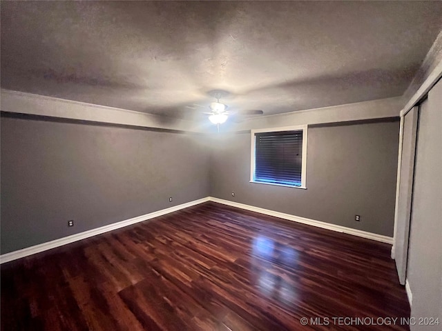 spare room featuring hardwood / wood-style flooring and ceiling fan