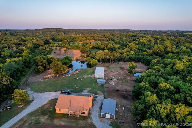 aerial view at dusk with a water view