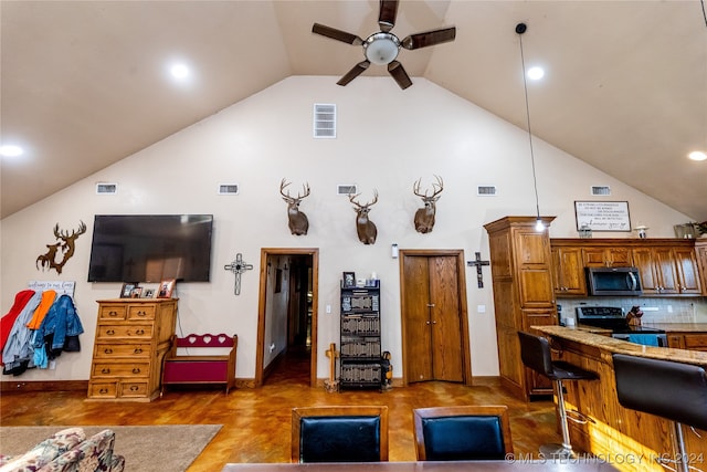 living room featuring lofted ceiling and ceiling fan