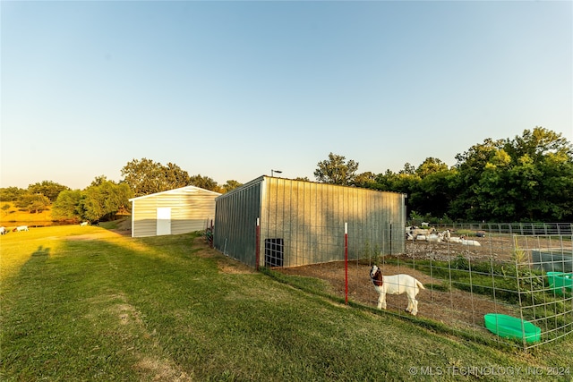 view of outdoor structure featuring a yard