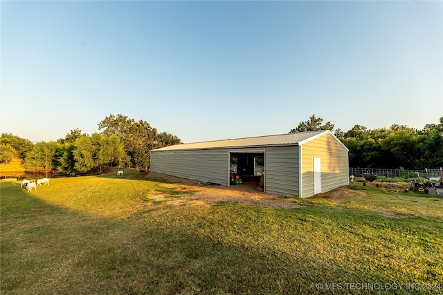 view of outdoor structure with a lawn