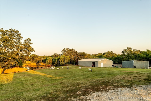 view of yard at dusk