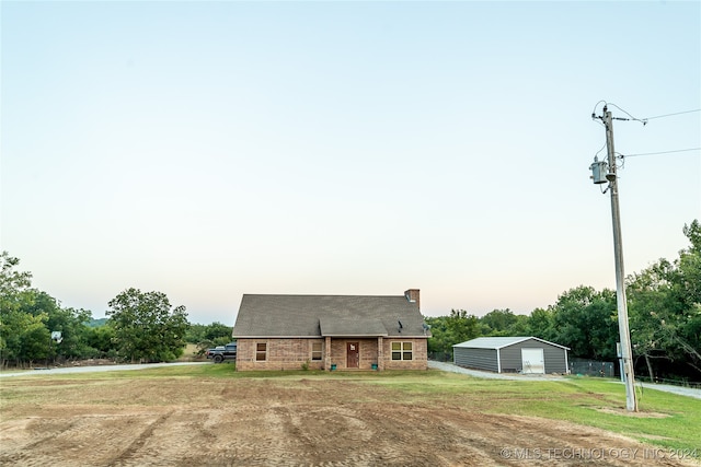 new england style home with an outbuilding