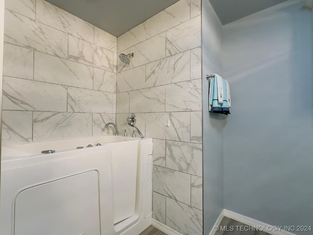 bathroom with separate shower and tub