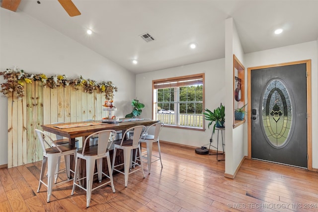 dining space featuring lofted ceiling, ceiling fan, and light hardwood / wood-style floors