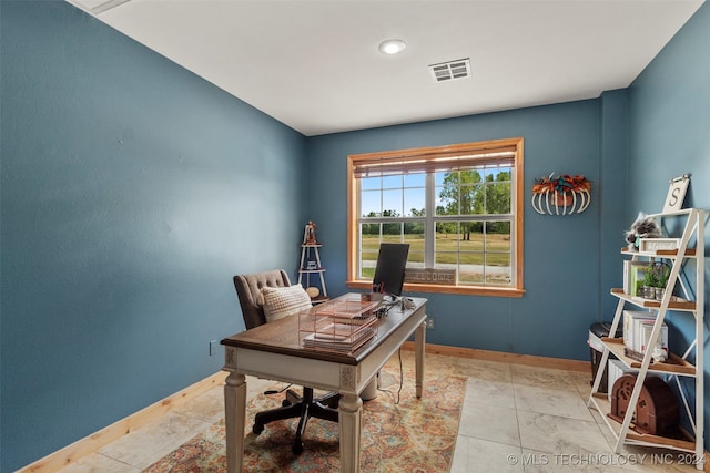 office space with light tile patterned floors