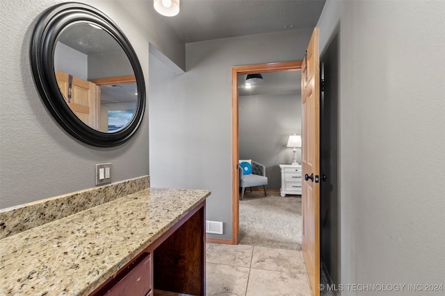 bathroom featuring vanity and tile patterned flooring