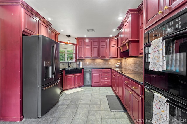 kitchen with black appliances, tasteful backsplash, light tile patterned floors, and sink