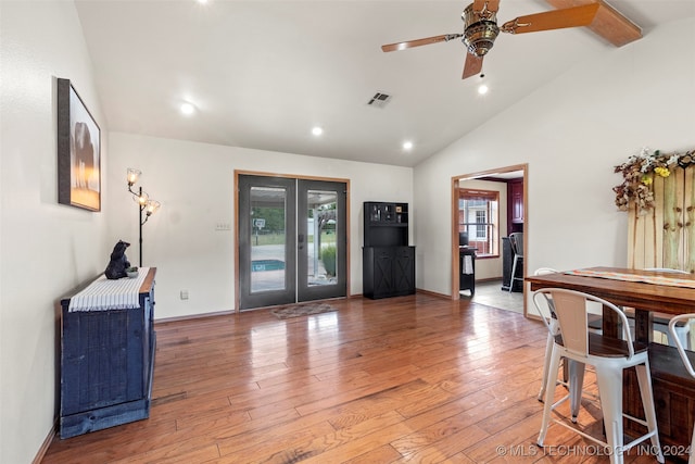 foyer with wood-type flooring, ceiling fan, plenty of natural light, and french doors