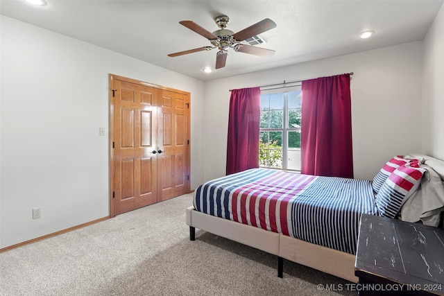 bedroom featuring a closet, ceiling fan, and carpet flooring