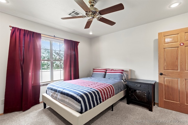 bedroom featuring light carpet and ceiling fan