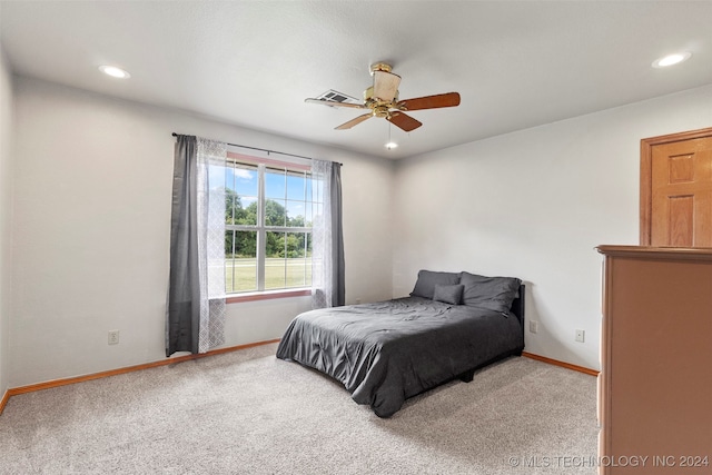 carpeted bedroom with ceiling fan