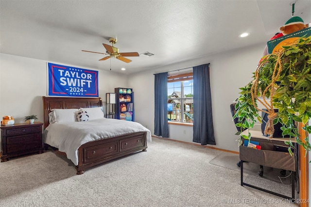 bedroom featuring light carpet and ceiling fan