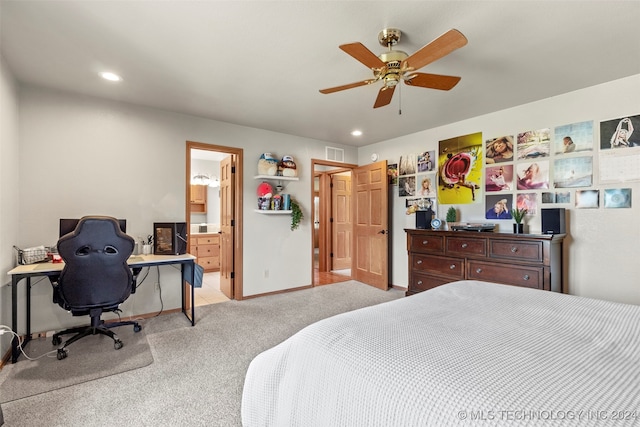 carpeted bedroom featuring connected bathroom and ceiling fan