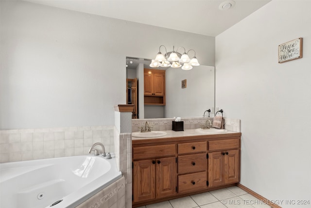 bathroom with vanity, a relaxing tiled tub, and tile patterned flooring