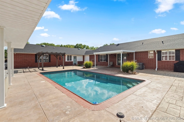 view of swimming pool featuring central AC and a patio area