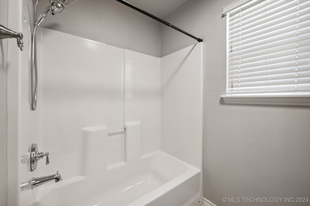 bathroom with bathing tub / shower combination