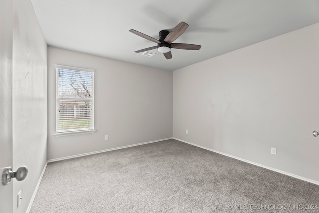 unfurnished room featuring carpet flooring and ceiling fan