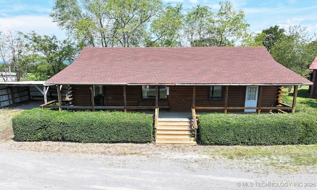 log home with covered porch