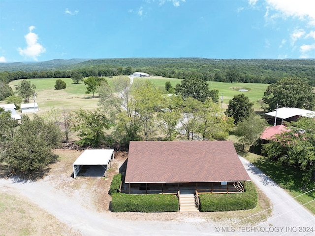 birds eye view of property with a rural view