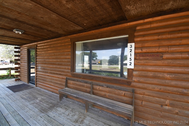 wooden terrace with a porch