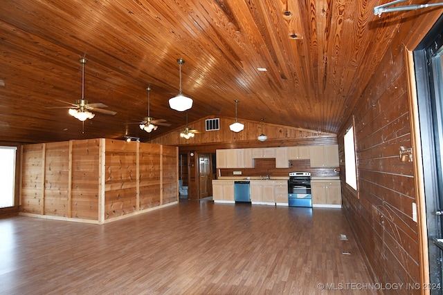 kitchen with white cabinets, appliances with stainless steel finishes, dark hardwood / wood-style flooring, and lofted ceiling