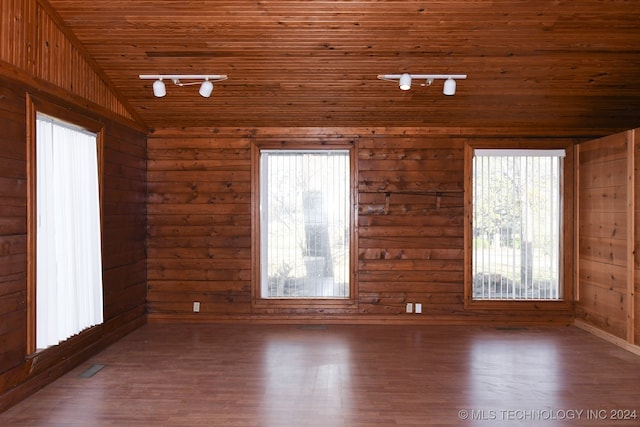 unfurnished room with dark hardwood / wood-style floors, wooden ceiling, and lofted ceiling