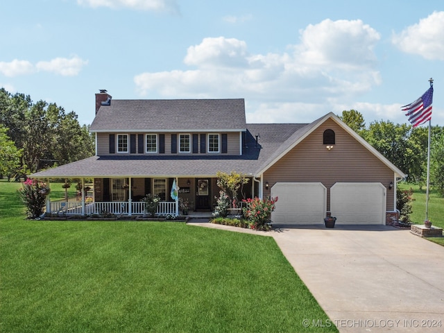 view of front of house featuring a front lawn, covered porch, and a garage