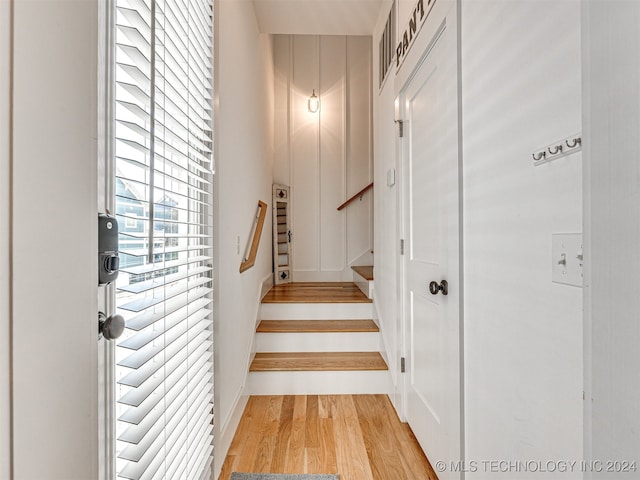 stairway with wood-type flooring