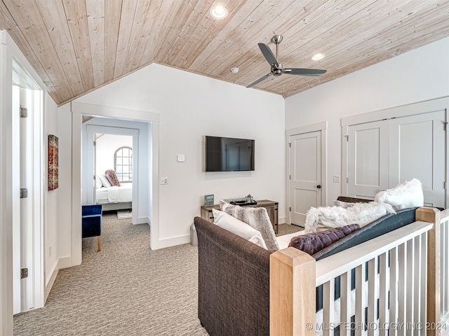 carpeted living room featuring wood ceiling, vaulted ceiling, and ceiling fan