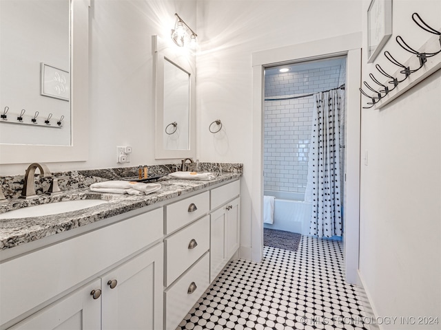 bathroom with tile patterned floors, shower / tub combo, and vanity