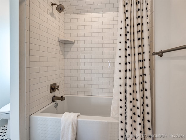 bathroom with toilet and shower / bathtub combination with curtain