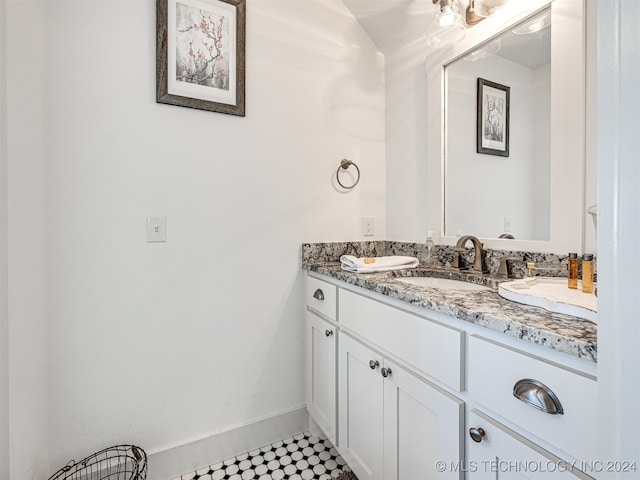 bathroom with vanity and tile patterned flooring