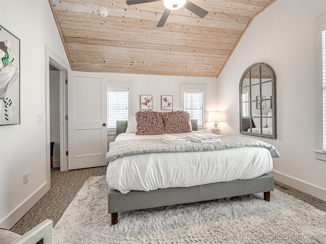 bedroom with ceiling fan, wooden ceiling, and vaulted ceiling