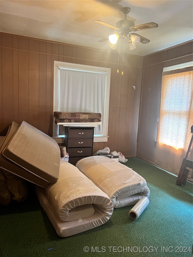 bedroom with ceiling fan and carpet floors