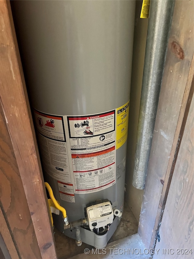 utility room featuring gas water heater