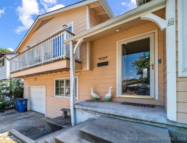 exterior space with a balcony and a garage