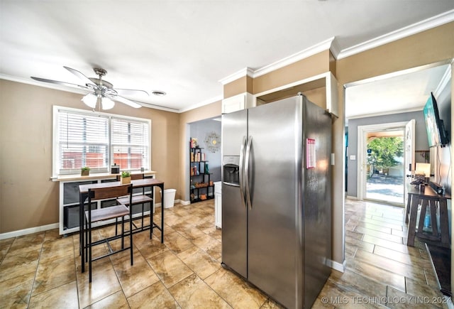 kitchen featuring crown molding, ceiling fan, light tile patterned floors, and stainless steel fridge with ice dispenser