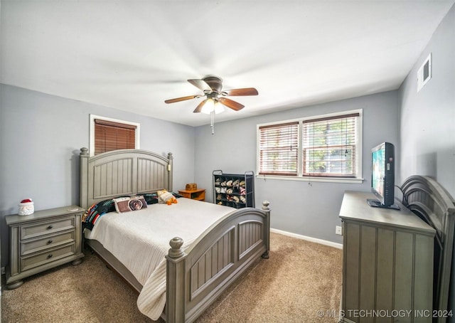 bedroom with ceiling fan and carpet floors