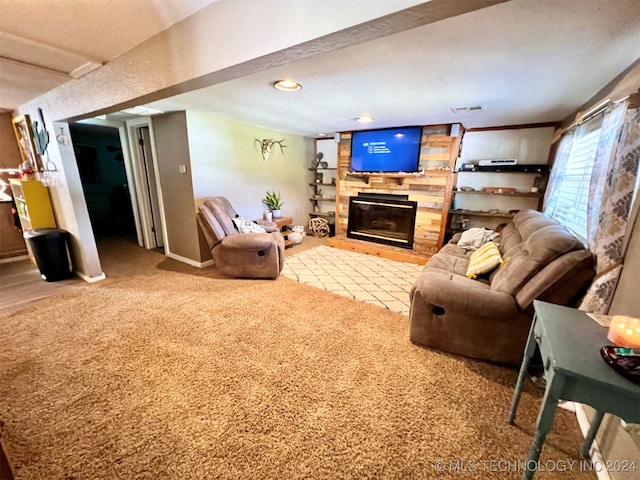 living room featuring carpet flooring, a textured ceiling, and a fireplace