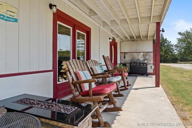 view of patio featuring a grill